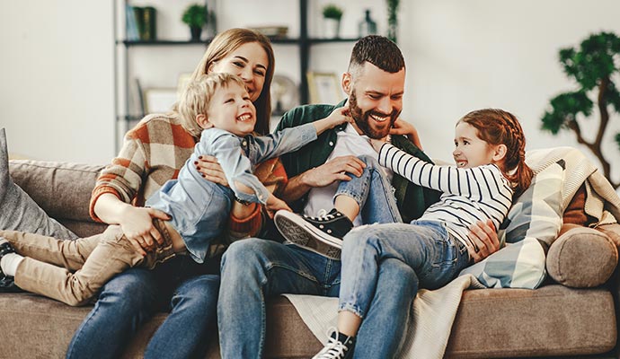 Happy family enjoying air quality in room