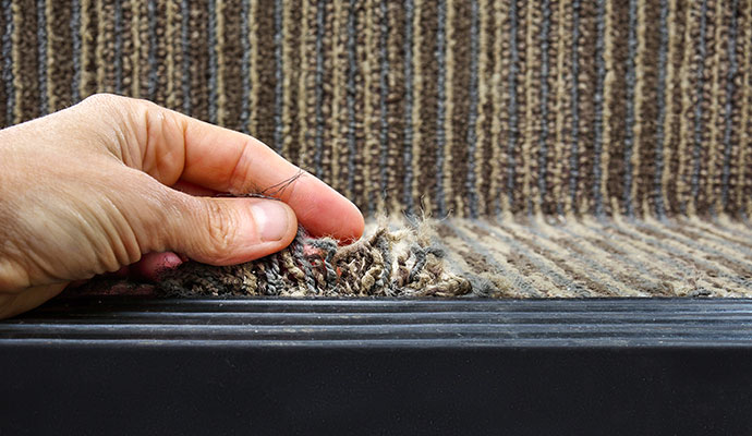 Damaged carpet inspection