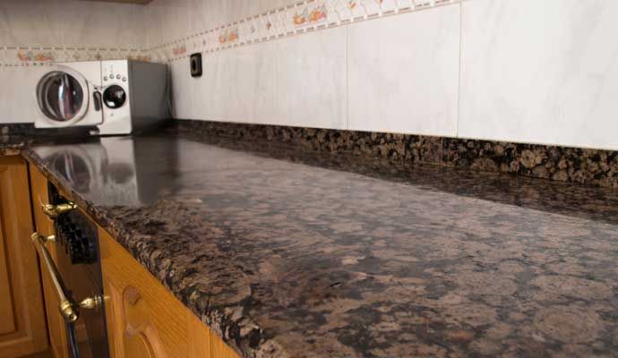 Clean granite kitchen countertop with polished surface