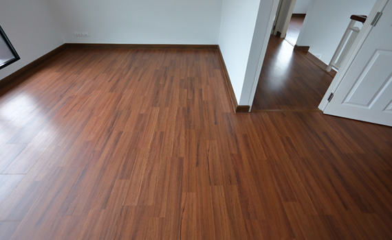 an empty room with clean laminated floor