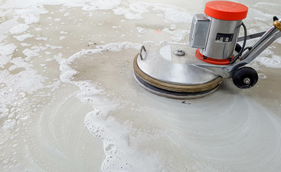 cleaning floor dirt using disk machine
