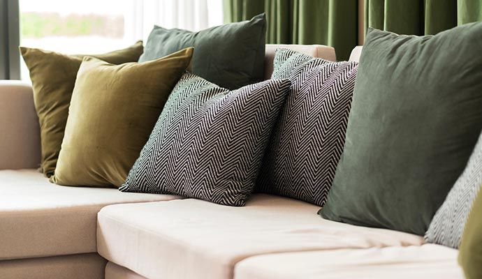 Colorful patterned throw pillows on the sofa