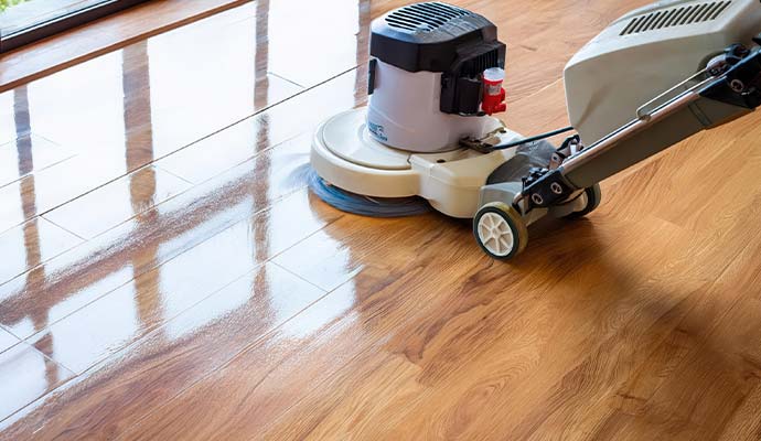 Commercial wood floor cleaning and polishing with a floor machine
