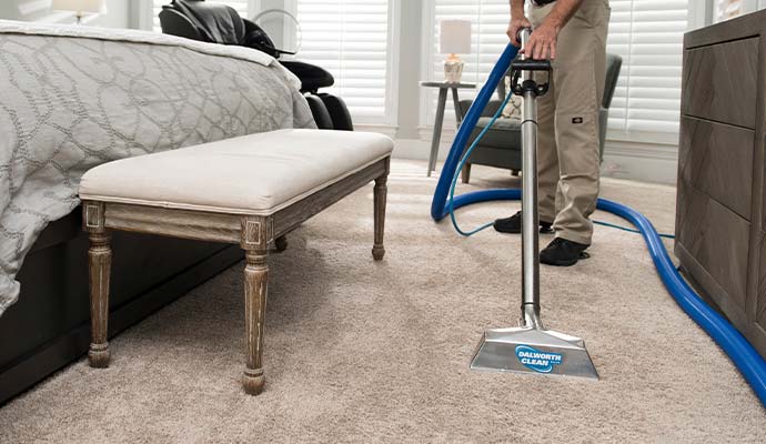 Dalworth Clean technician steam cleaning bedroom carpet