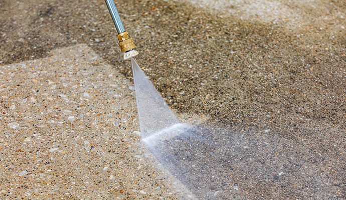 Concrete surface cleaning with pressure washer