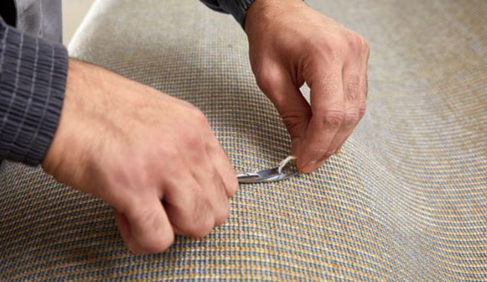 Professional carpet re-tufting and fiber repair service