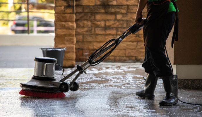 Professional floor scrubbing and cleaning service with rotary machine