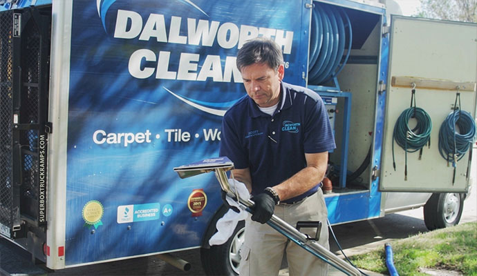 Carpet cleaning technician preparing equipment