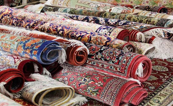 many clean colorful carpets stack on top of each other