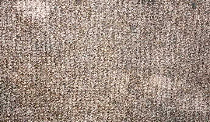 Soiled worn carpet fiber close-up