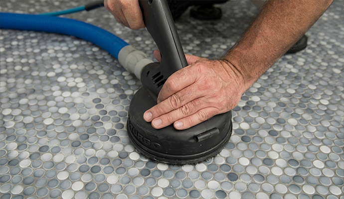 Wax removal with a machine on a tile floor