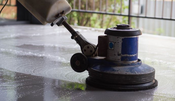 Concrete floor cleaning with machine